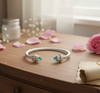 Two Tone Cable Bracelet with Blue Topaz Tips